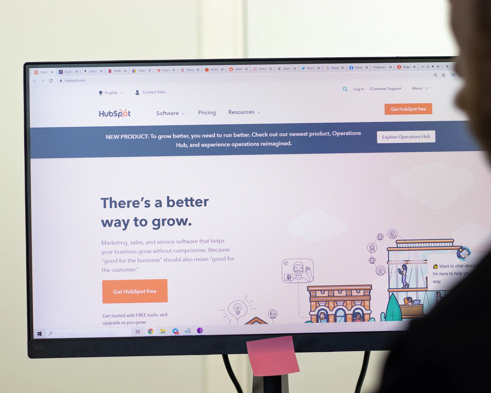 Un écran d'ordinateur affichant la plateforme HubSpot, présentant un logiciel de marketing et un message sur la croissance des entreprises.